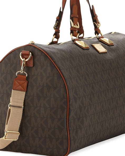 black michael kors duffel bag|Michael Kors large suitcase.